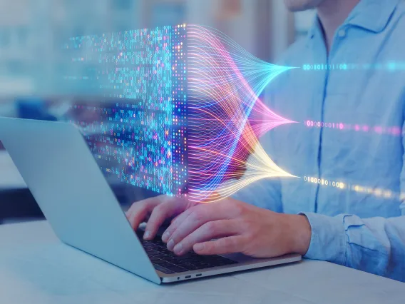 Person typing on a laptop keyboard