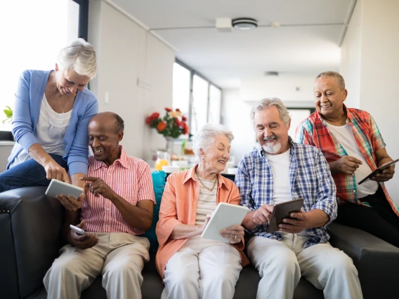 Senior adults using tablets