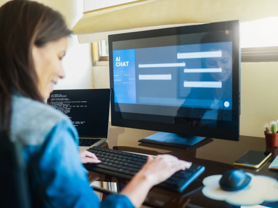 Women in front of a computer using an AI chatbot