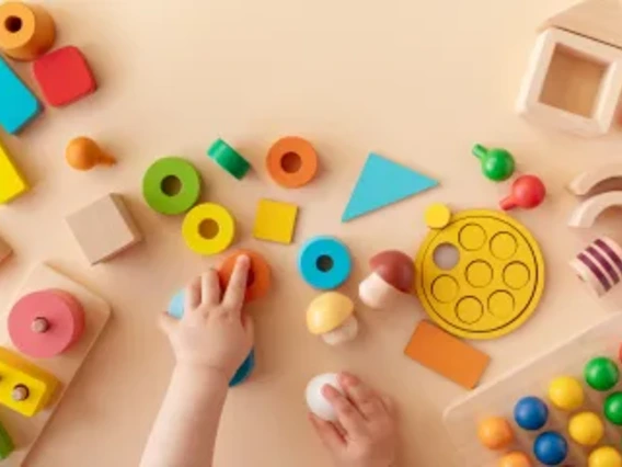 Aerial shot of children playing with building blocks