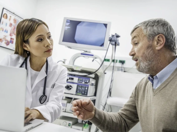 a patient and a doctor having a discussion in an exam room
