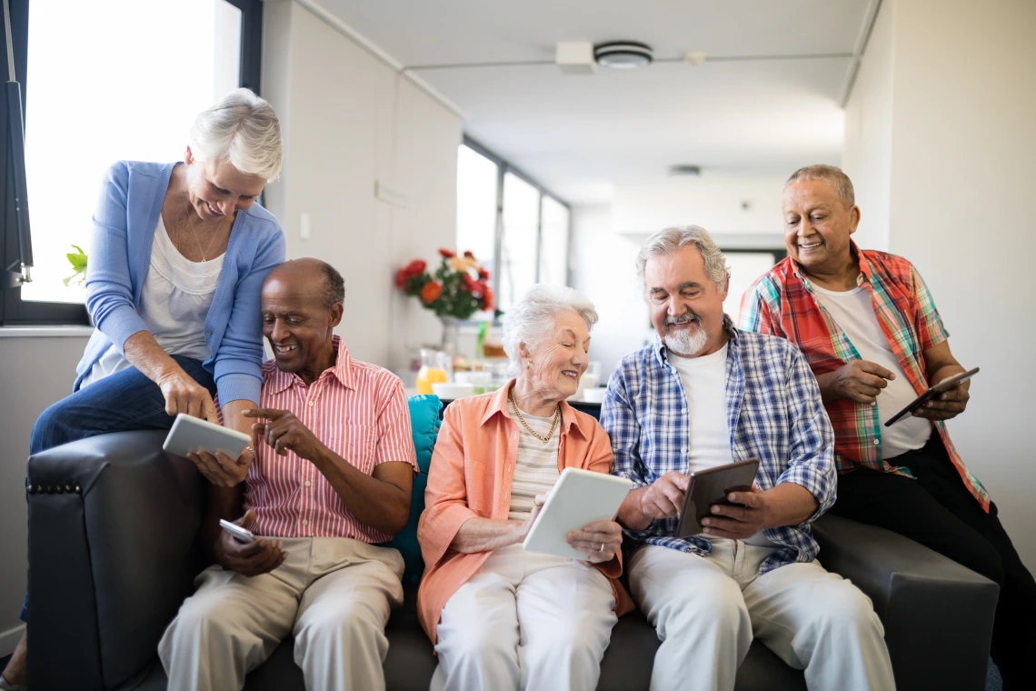 Senior adults using tablets
