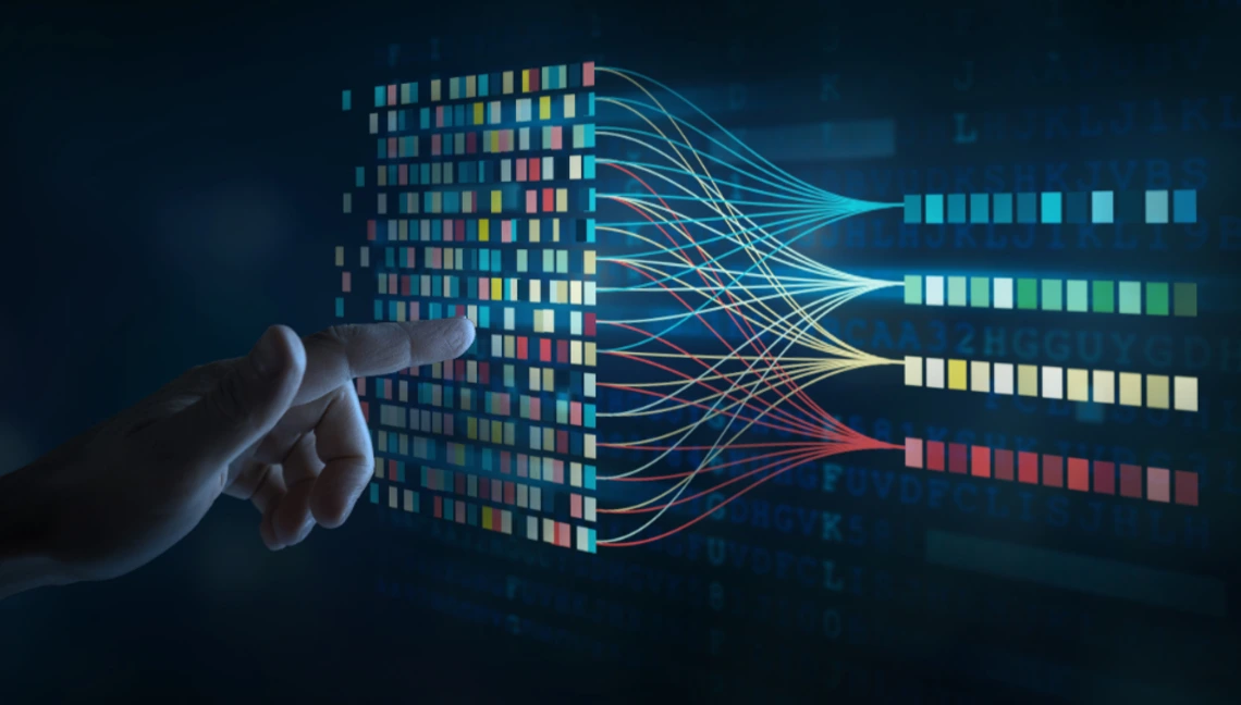 A human hand interacting with a digital interface of colorful data blocks and neural network connections, symbolizing artificial intelligence, machine learning algorithms, and human-computer collaboration in data analysis.