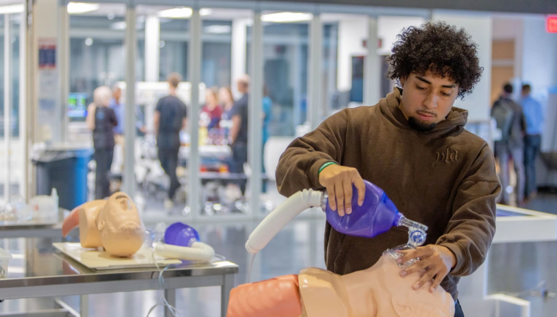 Image of medical students engaged in surgical simulation training